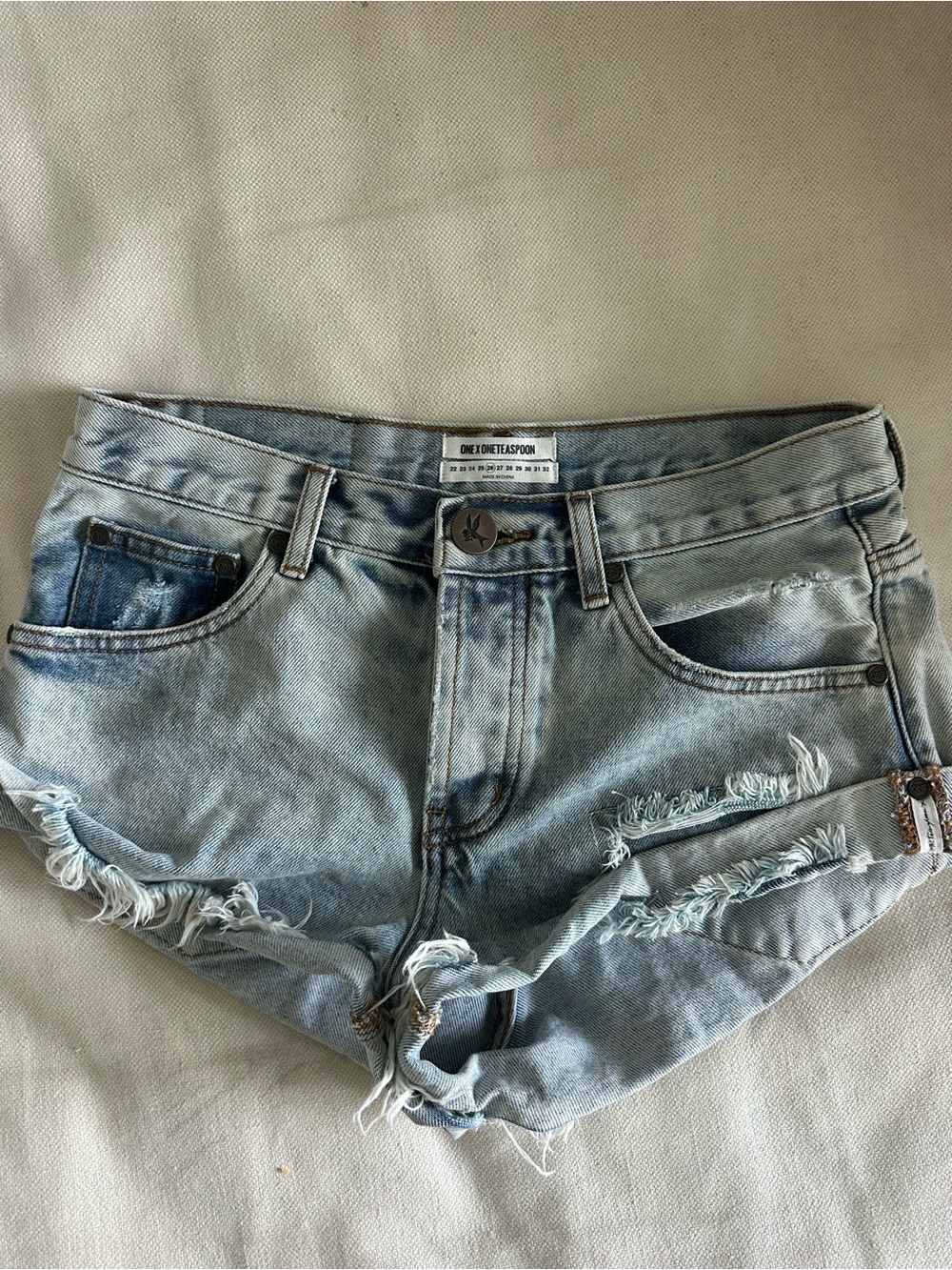 One Teaspoon faded light blue distressed denim cutoff shorts